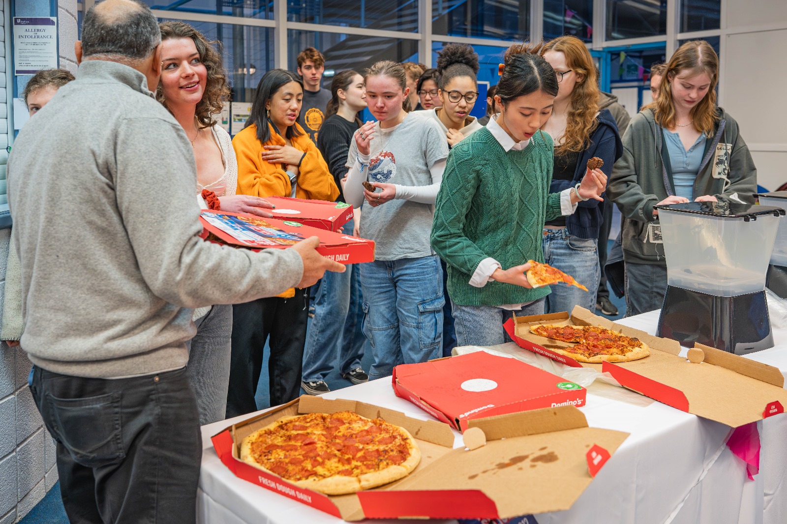 Members enjoying a pizza party